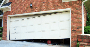 Broken garage door off its track frame.