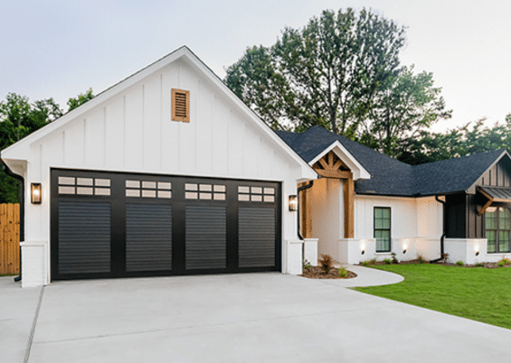 black garage door exterior on white house