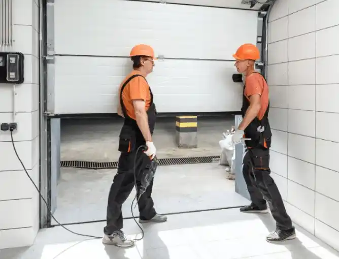 experts repairing a garage door
