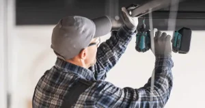 expert repairing a garage door